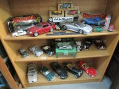 3 shelves of die cast including Burago etc