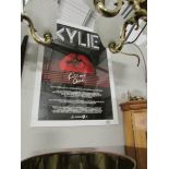 A framed and glazed Kylie poster