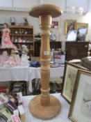 A wooden plant stand/torchere