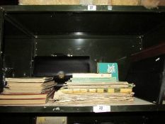 A shelf of miscellaneous music books,