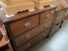 A 2 over 2 chest of drawers