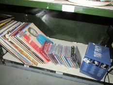 A shelf of LP records and CD's