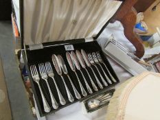 A cased set of fish knives and forks with other cutlery