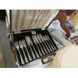 A cased set of fish knives and forks with other cutlery