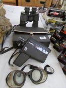 A cased Halina Super Eight camera, a pair of Praktika sport binoculars,