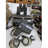 A cased Halina Super Eight camera, a pair of Praktika sport binoculars,