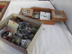 A jewellery box with contents and another box of costume jewellery