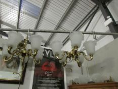 A pair of brass ceiling lights and a pair of matching wall lights