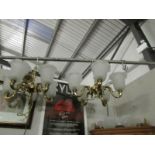 A pair of brass ceiling lights and a pair of matching wall lights