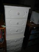 A pair of white 3 drawer bedside chests