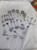 A mixed lot of collector's spoons, napkin rings,