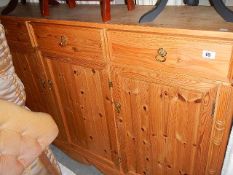 A pine 3 door cupboard