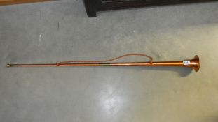 A long copper hunting horn