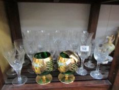 A mixed lot of glassware including a pair of green and gold brandy goblets