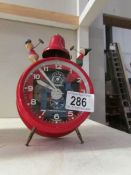 A vintage German Mickey Mouse alarm clock