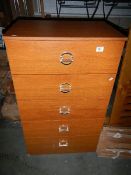 A pair of 5 drawer chests