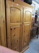 A 2 door pine wardrobe