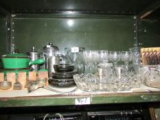 A shelf of assorted glass ware etc