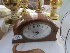 A mahogany inlaid mantel clock