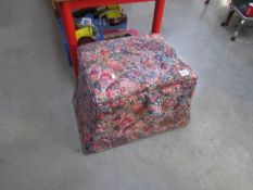 An upholstered storage stool
