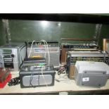 A shelf of various radio's etc