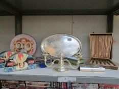 A shelf of tins, silver plate,