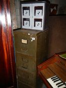 A 4 drawer filing cabinet and a small metal cabinet