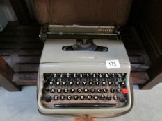 A cased Olivetti portable typewriter