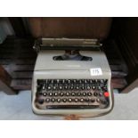 A cased Olivetti portable typewriter