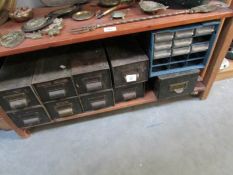 A shelf of workshop drawers and contents