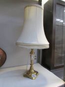 A Victorian brass lamp