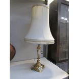 A Victorian brass lamp