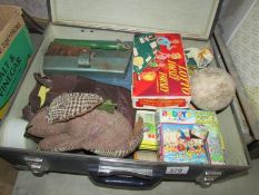 A BEA Gliobe trotter suitcase with children's contents including Rupert annuals,