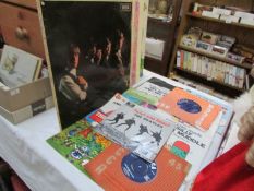 A quantity of 45rpm and LP records including Beatles,