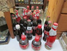 A collection of Coca Cola bottles