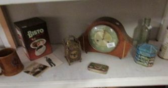 A mixed lot including 2 clocks, old tins,