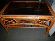 A bamboo and glass coffee table