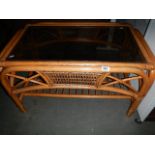 A bamboo and glass coffee table