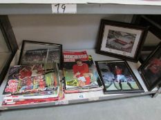 A mixed lot of Manchester United football programmes and photographs