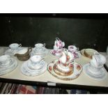 A shelf of assorted tea ware