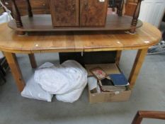 An oval rustic style dining table