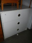 A white 3 drawer chest