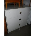 A white 3 drawer chest