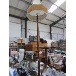 An oak standard lamp with shade