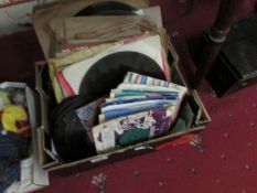 A box of 45 rpm and LP records