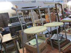 A pair of retro kitchen chairs