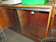 A glazed sliding door book case,