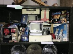 A shelf of boxed electrical items including telephone.