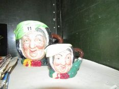 A large Royal Doulton Sarey Gamp character jug and a smaller example.