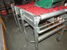 A concertina conveyer roller table.